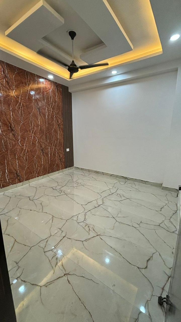 Meraik Infra apartment bedroom with accent wall